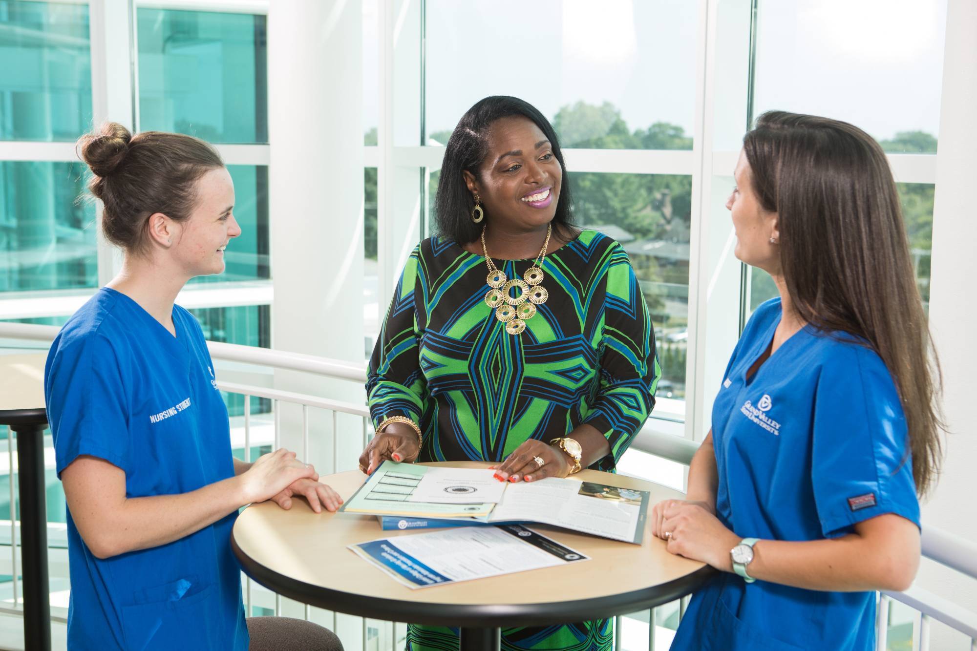 advisor talking with nursing students